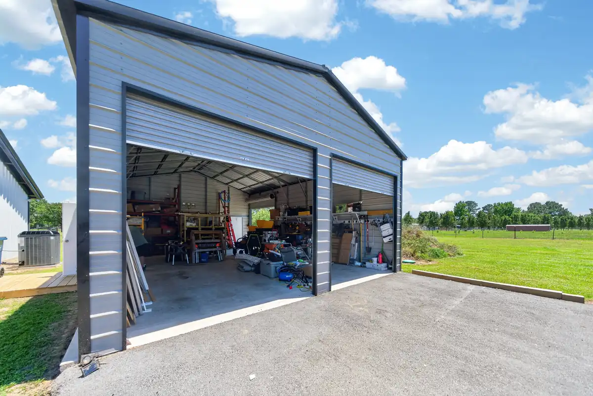 25x35 detached metal shop with two roll-up doors and concrete floor, barndominium Chandler TX