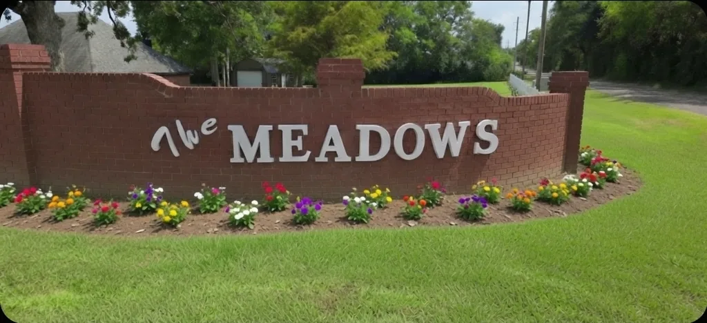 The Meadows subdivision entrance sign on the south end of Lake Palestine near Frankston, Texas.