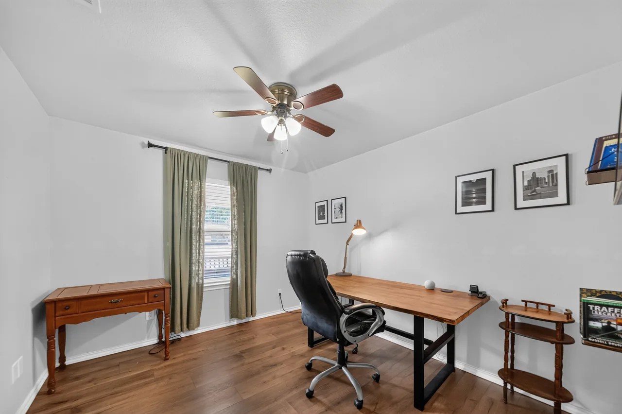 Third bedroom set up as a home office at 1054 Caroline Ln in Shadybrook, a gated Lake Palestine community in Bullard, TX.